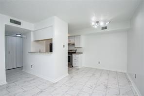 17331 Red Oak Drive, Unit 45 Houston, TX 77090 - Photo 6 of 25 a view of a kitchen with a sink and refrigerator in it