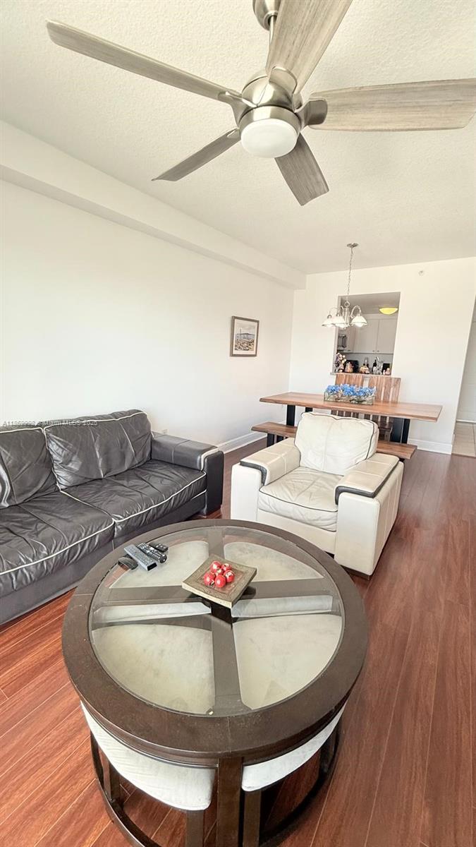 1250 South Miami Avenue, Unit 1913 Miami, FL 33130 - Photo 12 of 29 a living room with furniture and a wooden floor