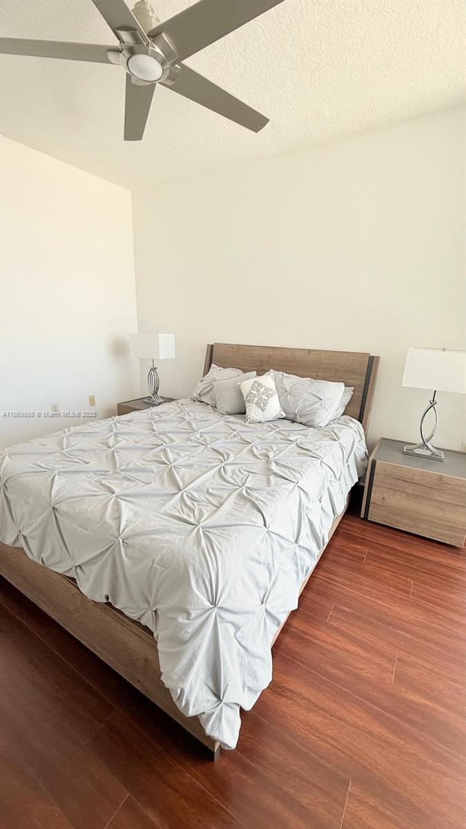 1250 South Miami Avenue, Unit 1913 Miami, FL 33130 - Photo 16 of 29 a bedroom with a bed and wooden floor