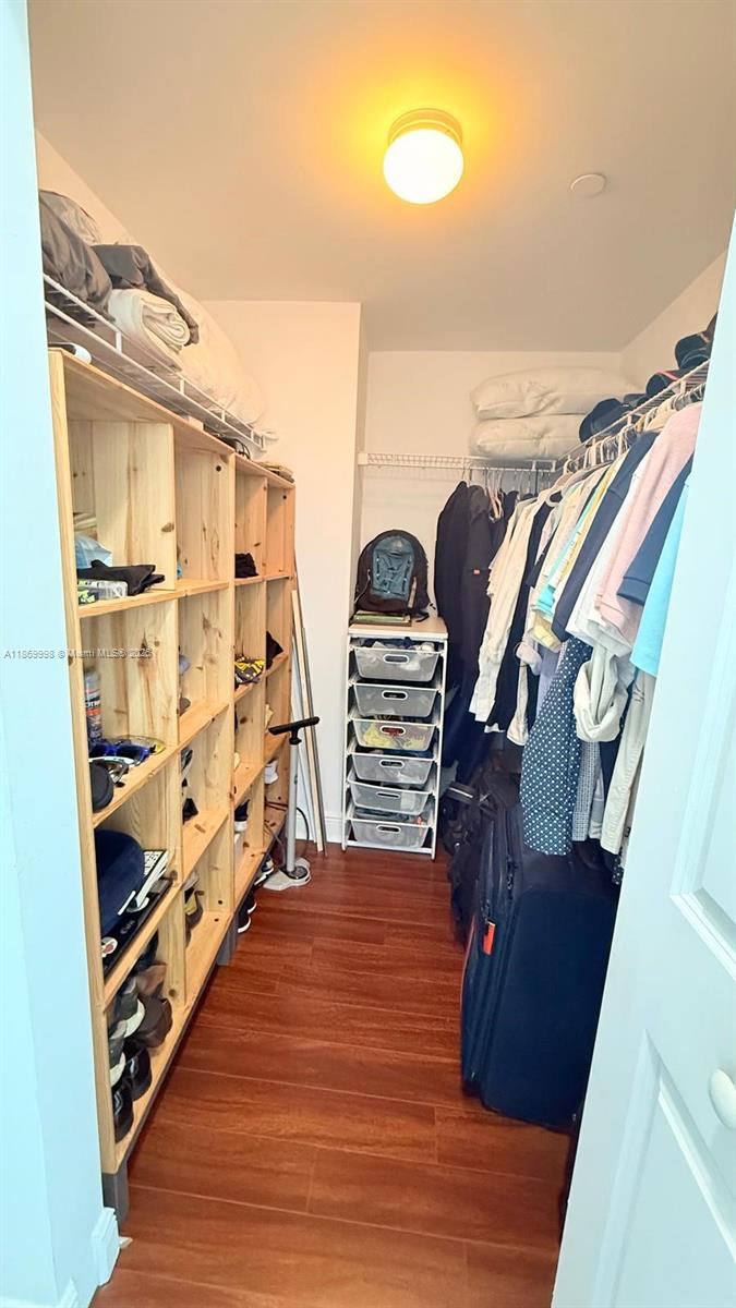 1250 South Miami Avenue, Unit 1913 Miami, FL 33130 - Photo 20 of 29 a view of walk in closet with clothes and shoes