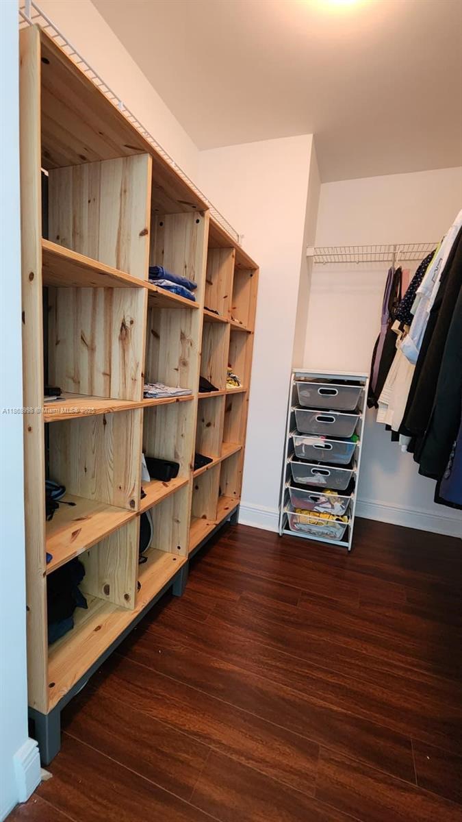 1250 South Miami Avenue, Unit 1913 Miami, FL 33130 - Photo 21 of 29 a view of an empty room with wooden floor and closet