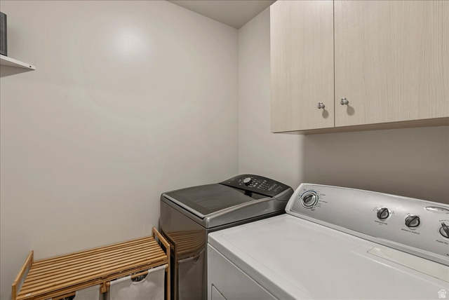 287 North 100th West Morgan, UT 84050 - Photo 18 of 27 Laundry room with cabinet space and washer and dryer