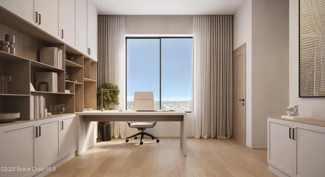 a view of a room that has a bed and a window in it