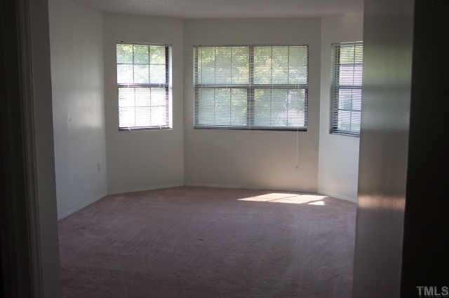 1514 Joe Louis Avenue Raleigh, NC 27610 - Photo 2 of 8 an empty room with a window