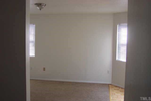 1514 Joe Louis Avenue Raleigh, NC 27610 - Photo 3 of 8 a view of an empty room and window