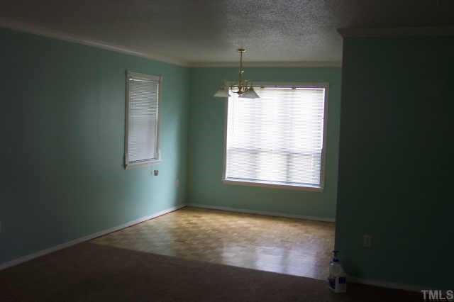1514 Joe Louis Avenue Raleigh, NC 27610 - Photo 5 of 8 a view of an empty room with a window