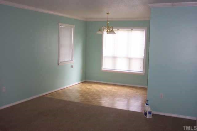1514 Joe Louis Avenue Raleigh, NC 27610 - Photo 6 of 8 a view of an empty room with a window