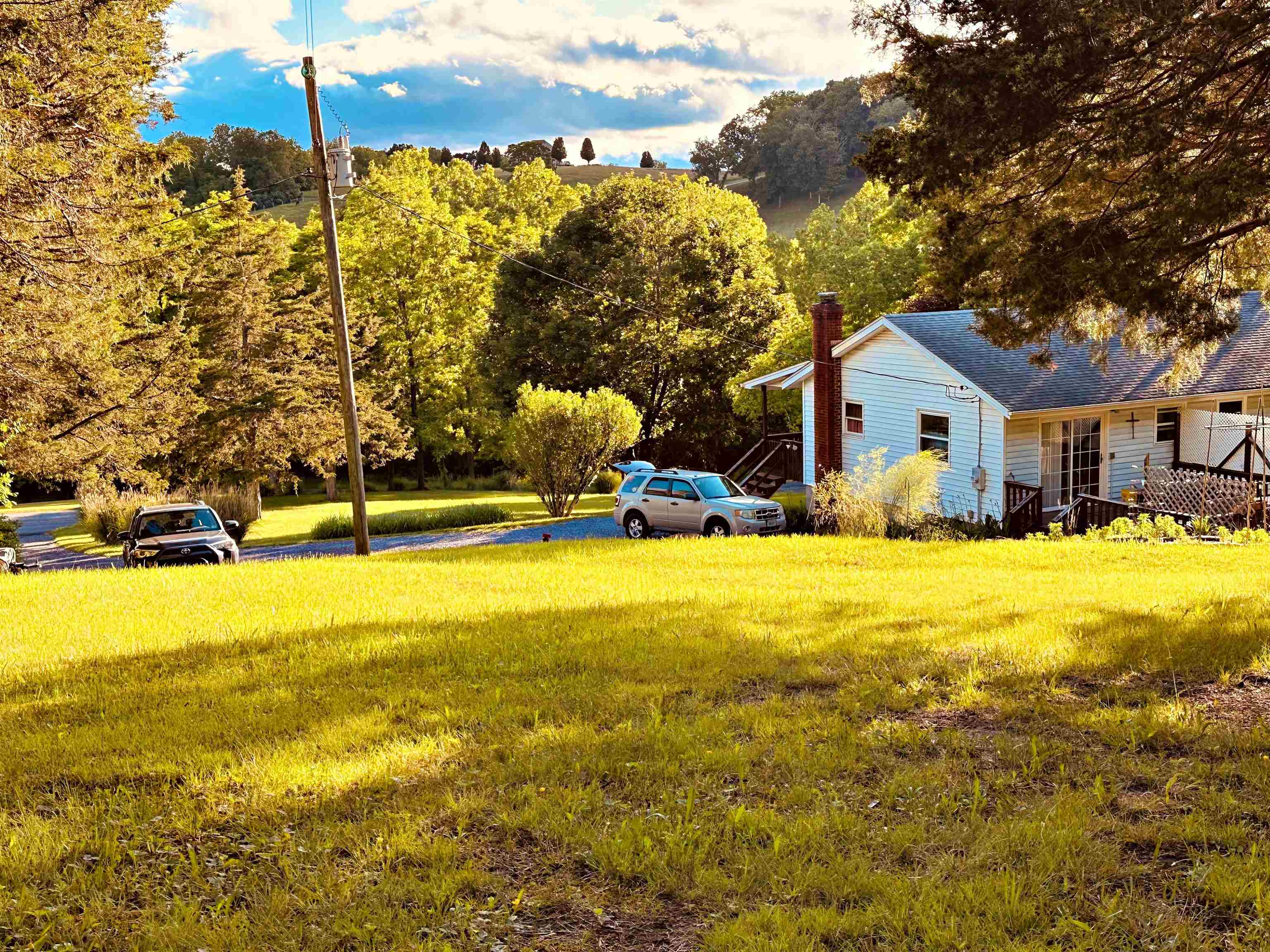 562 Dabneys Road Raphine, VA 24472 - Photo 6 of 14 a yellow house with swimming pool in front of it