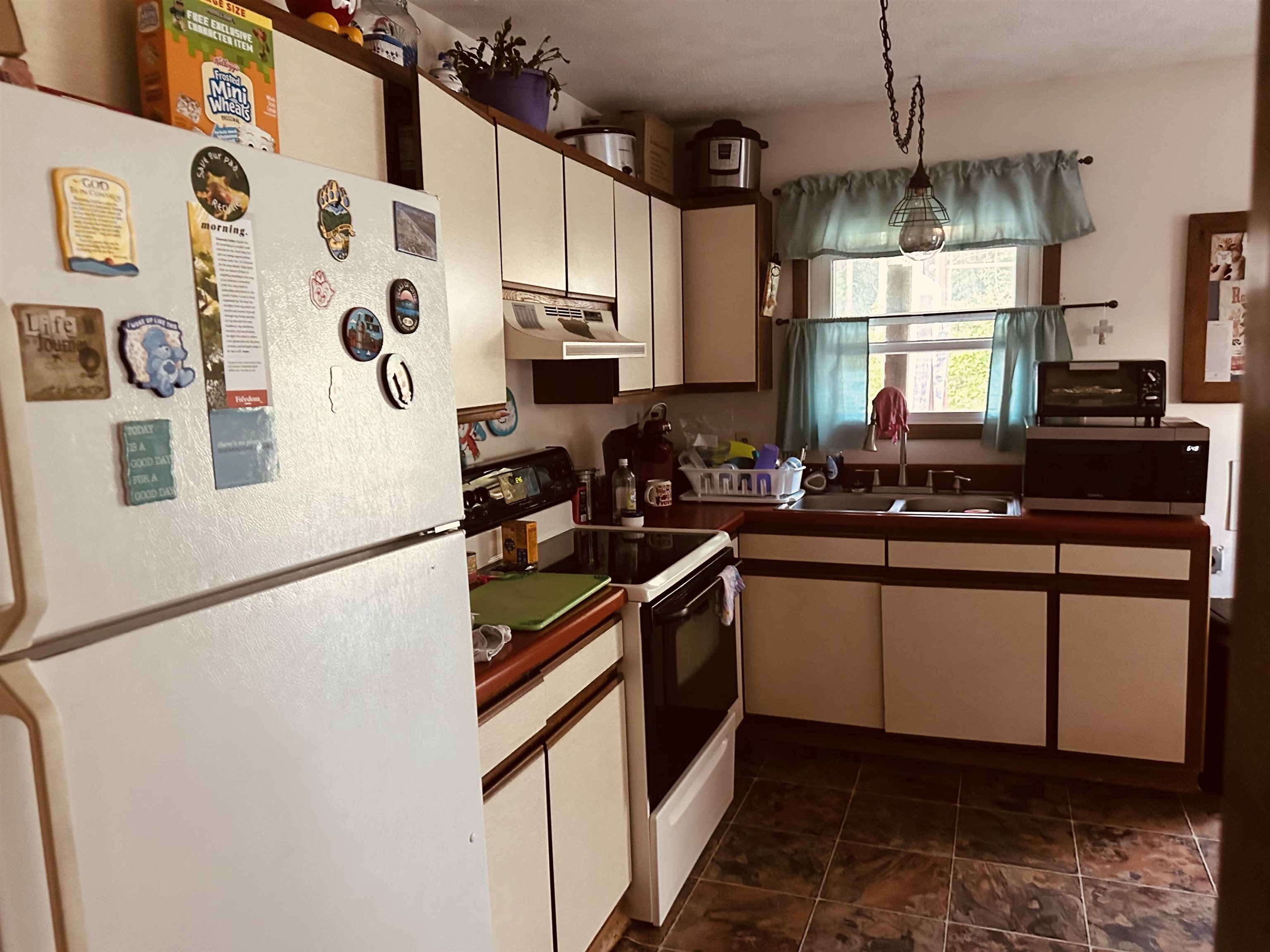 562 Dabneys Road Raphine, VA 24472 - Photo 10 of 14 a kitchen with stainless steel appliances granite countertop a sink and a stove
