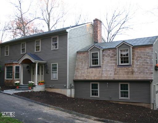 405 Limestone Road Ridgefield, CT 06877 - Photo 1 of 1 a front view of a house with yard