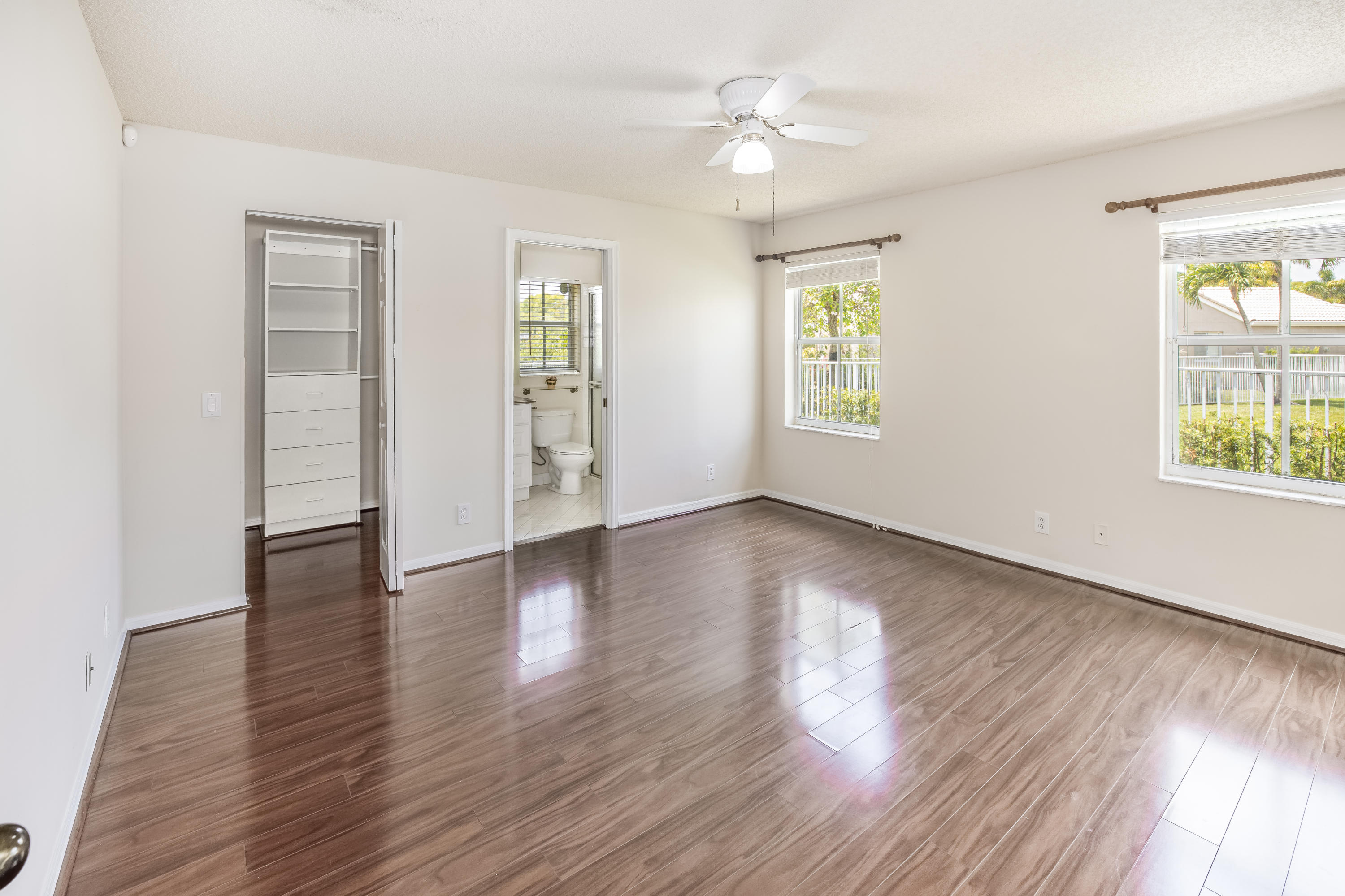 4244 Pine Ridge Court Weston, FL 33331 - Photo 15 of 34 a view of an empty room with wooden floor and a window