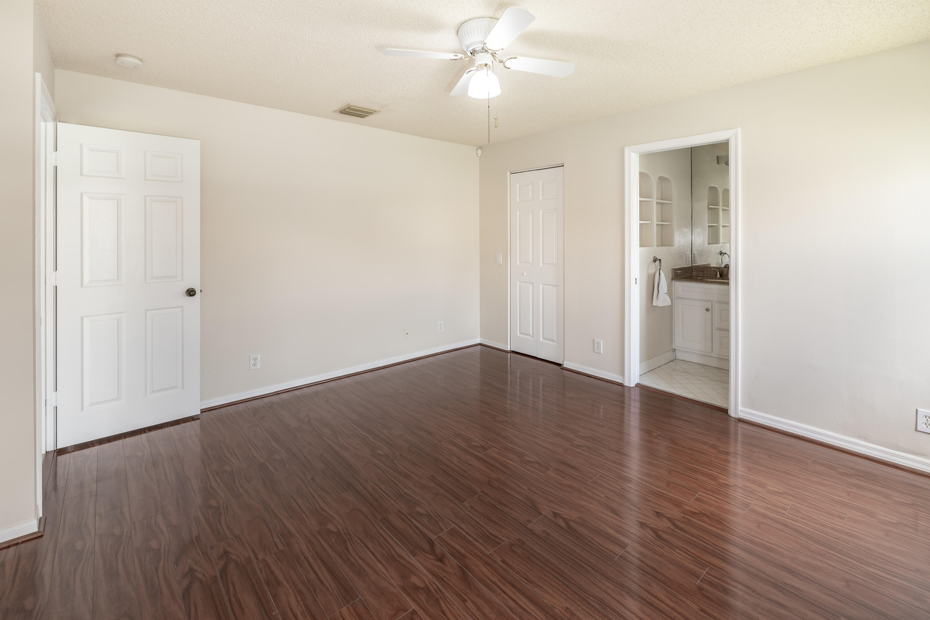 4244 Pine Ridge Court Weston, FL 33331 - Photo 16 of 34 an empty room with wooden floor closet and windows
