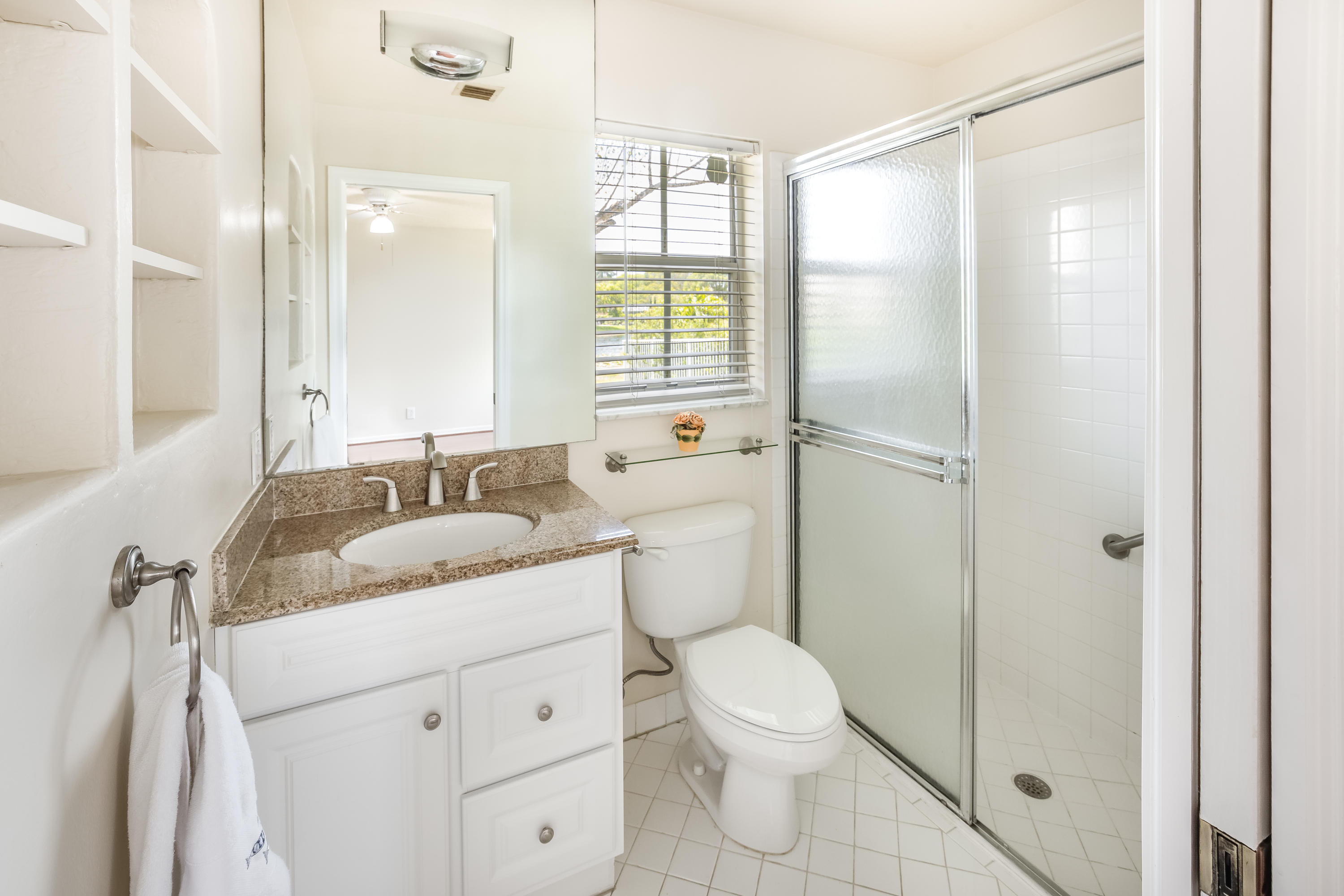 4244 Pine Ridge Court Weston, FL 33331 - Photo 17 of 34 a bathroom with a granite countertop sink toilet and shower