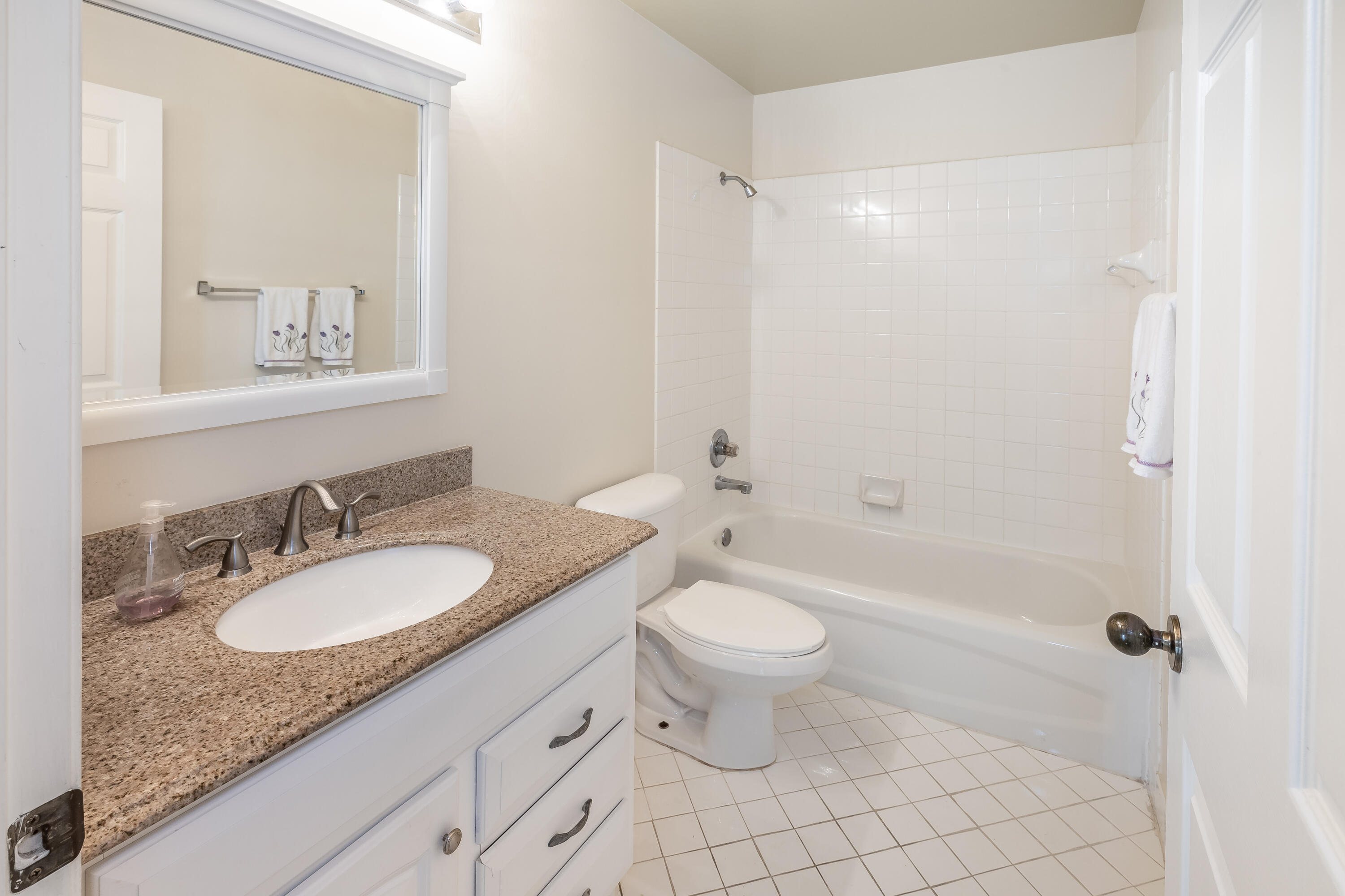 4244 Pine Ridge Court Weston, FL 33331 - Photo 21 of 34 a bathroom with a granite countertop sink toilet mirror and bathtub