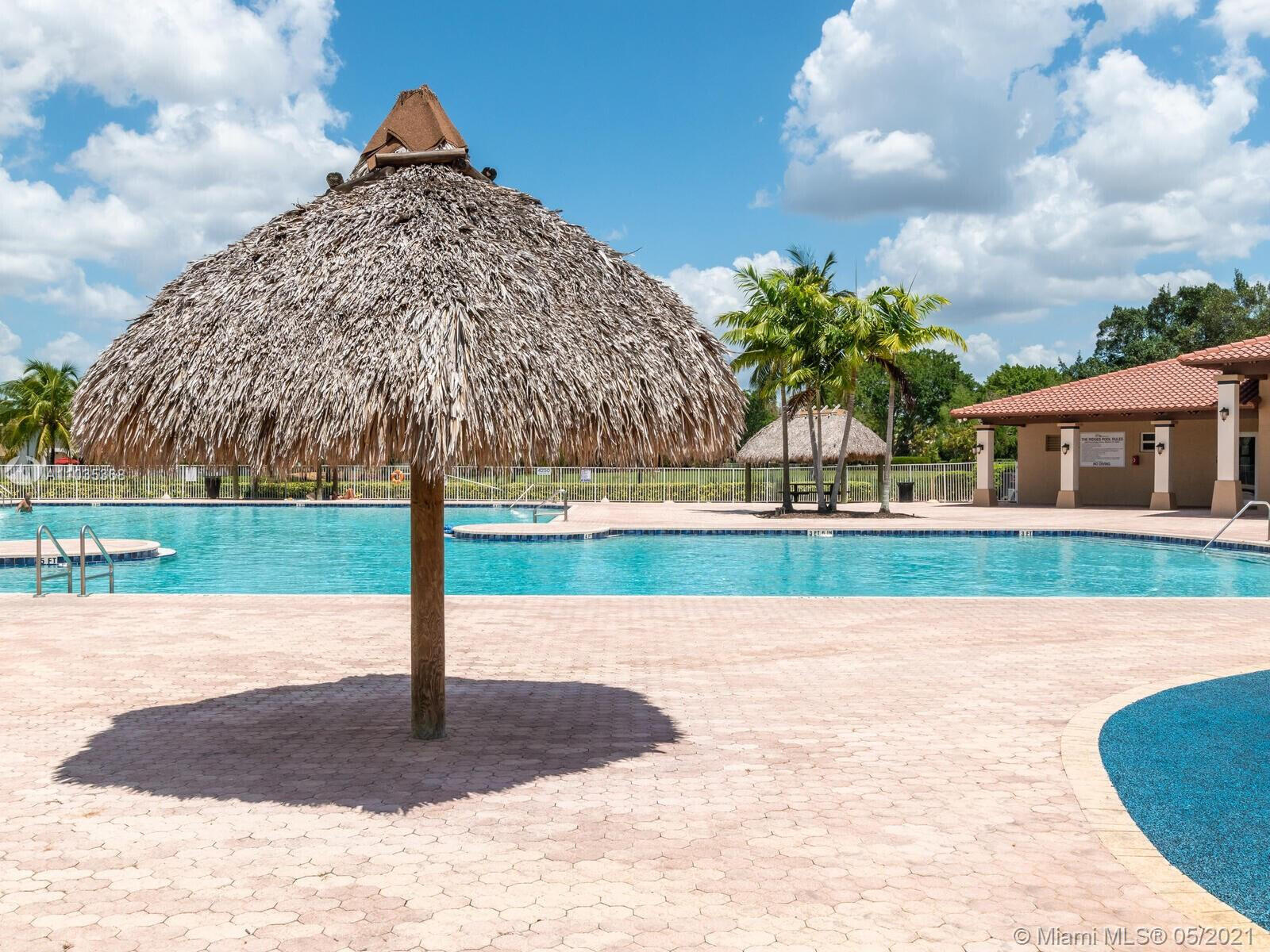 4244 Pine Ridge Court Weston, FL 33331 - Photo 29 of 34 a view of a house with a yard