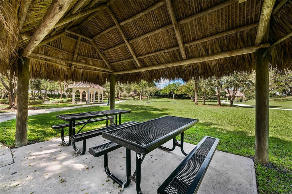 4244 Pine Ridge Court Weston, FL 33331 - Photo 32 of 34 a view of a backyard with sitting area