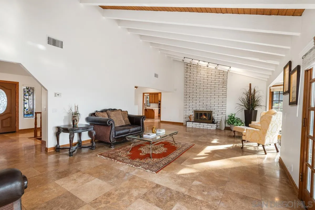 15918 Lime Grove Road Poway, CA 92064 - Photo 20 of 53 a living room with furniture large window and a fireplace