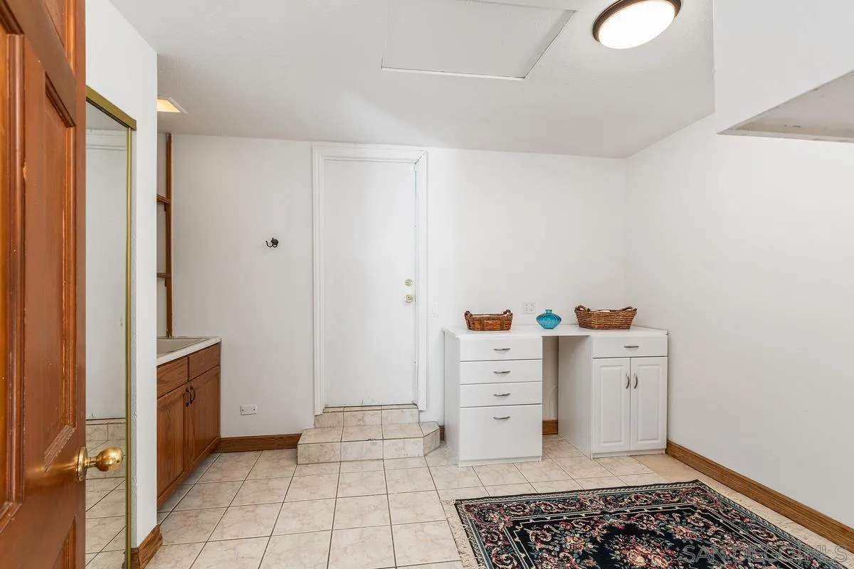 15918 Lime Grove Road Poway, CA 92064 - Photo 25 of 53 a room with a baby crib and a dresser