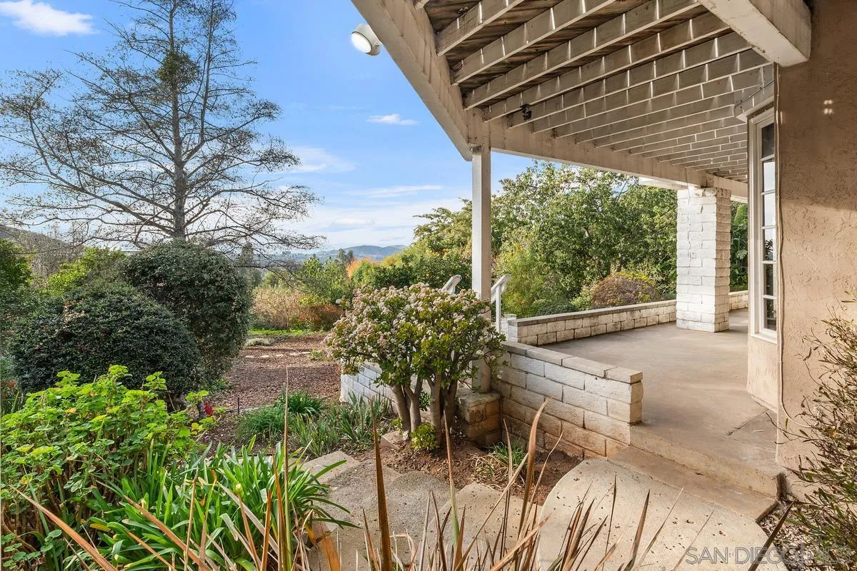 15918 Lime Grove Road Poway, CA 92064 - Photo 39 of 53 a view of a patio with table and chairs and potted plants