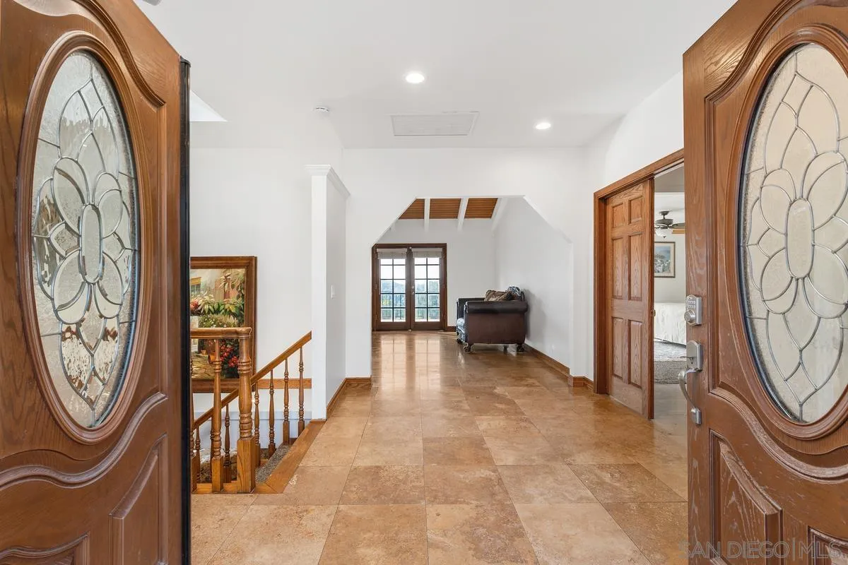 15918 Lime Grove Road Poway, CA 92064 - Photo 5 of 53 a view of a hallway with washer and dryer
