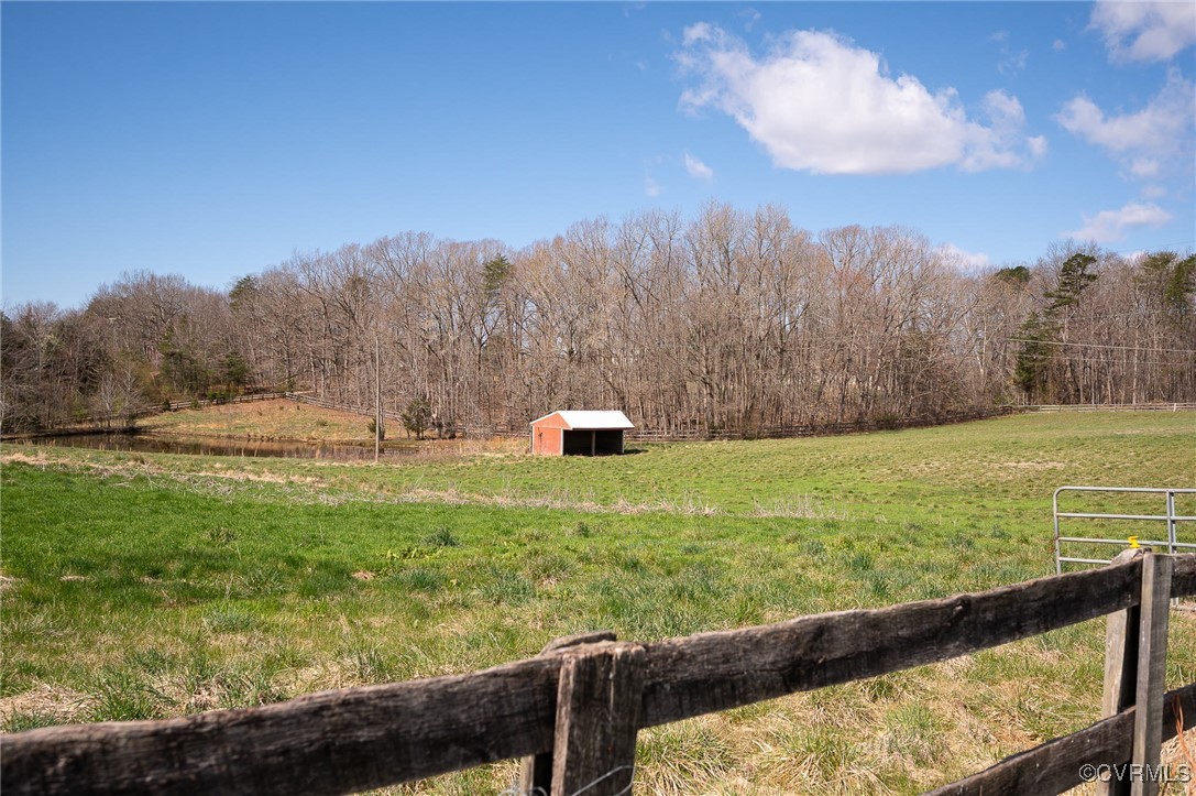 View of yard with a rural view