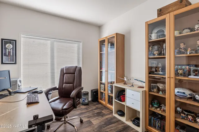 a work room with furniture and book shelf