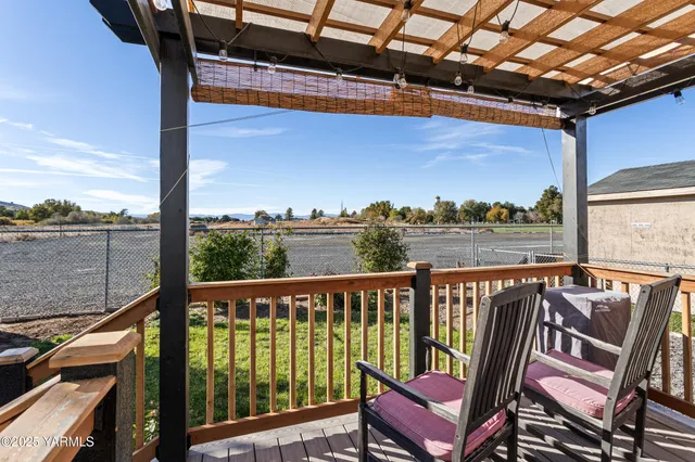 a view of a balcony with chairs