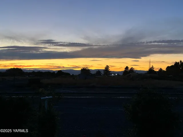 a view of ocean with a sunset