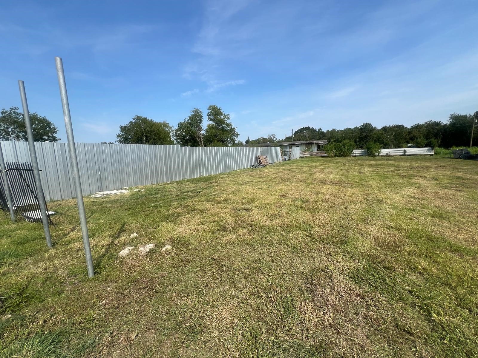 3367 Bijou Rue Rosharon, TX 77583 - Photo 3 of 3 a backyard of a house with lots of green space and lake view