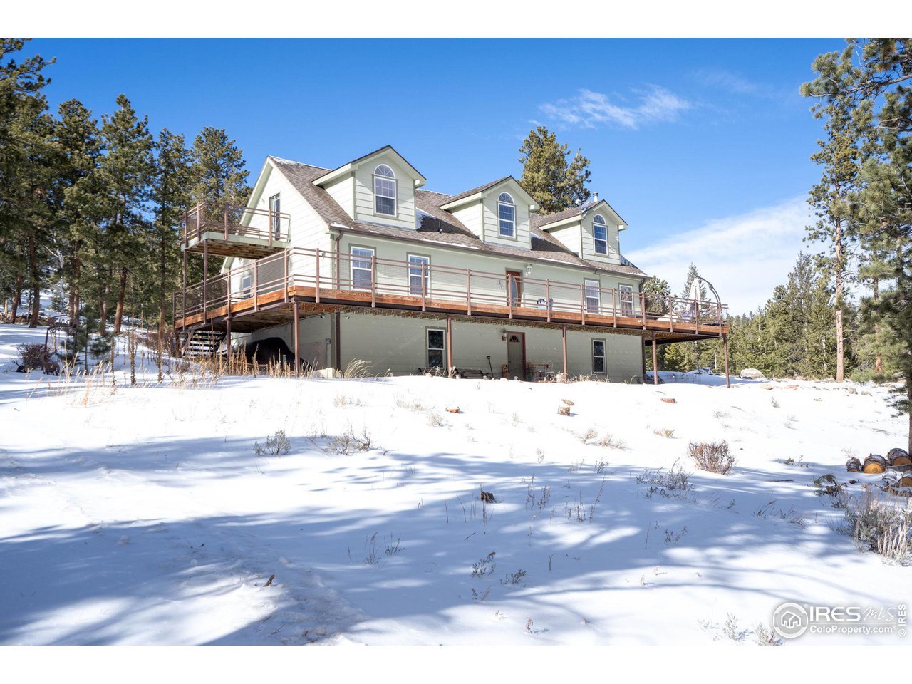 a view of a house with snow on the ground