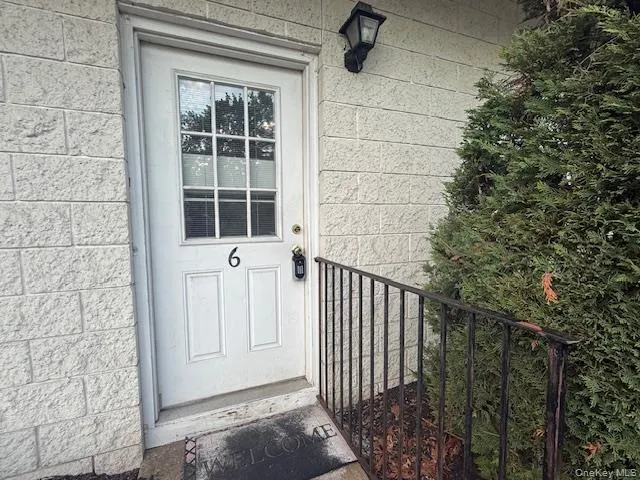 a view of a door and a window