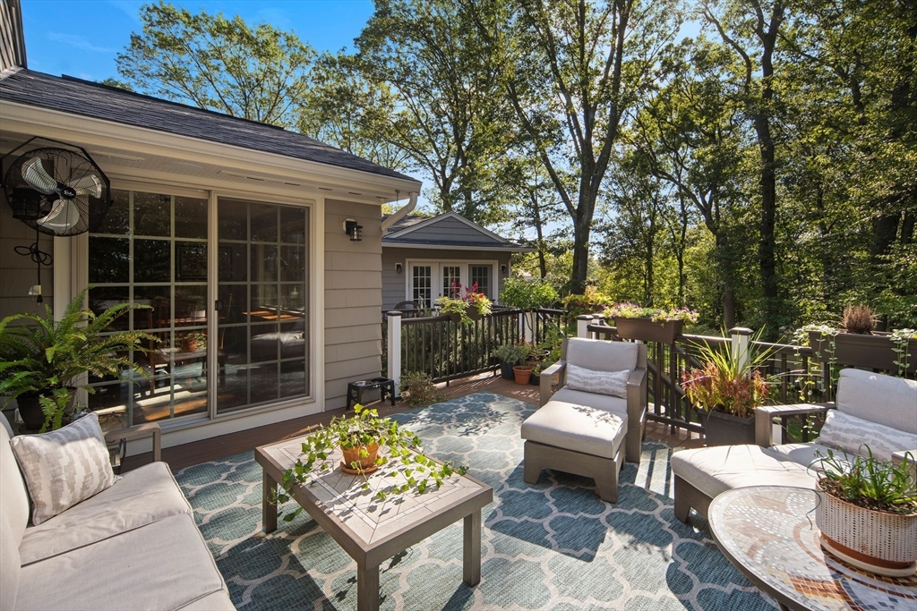 22 Peachtree Road Lexington, MA 02420 - Photo 11 of 42 a view of a patio with couches table and chairs and potted plants