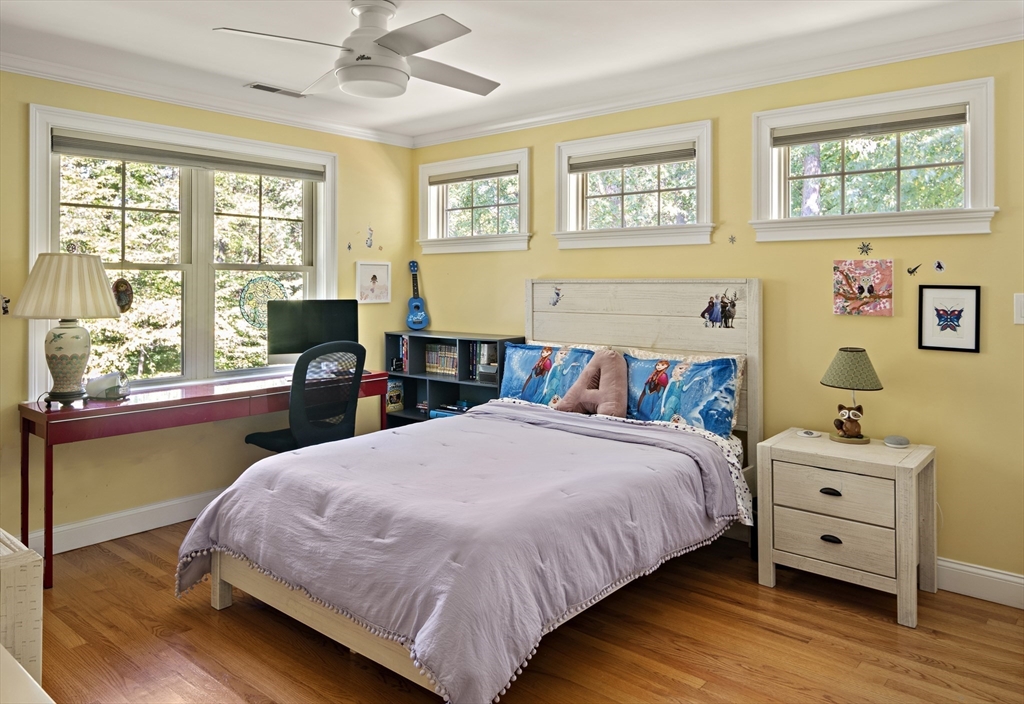 22 Peachtree Road Lexington, MA 02420 - Photo 20 of 42 a bedroom with a bed and wooden floor