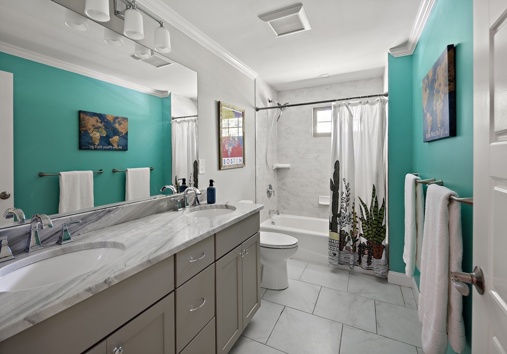 22 Peachtree Road Lexington, MA 02420 - Photo 21 of 42 a bathroom with a granite countertop sink toilet and shower