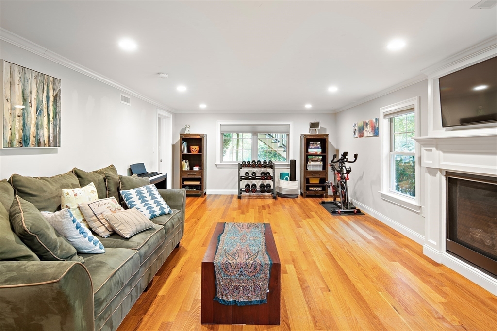22 Peachtree Road Lexington, MA 02420 - Photo 23 of 42 a living room with furniture and a flat screen tv