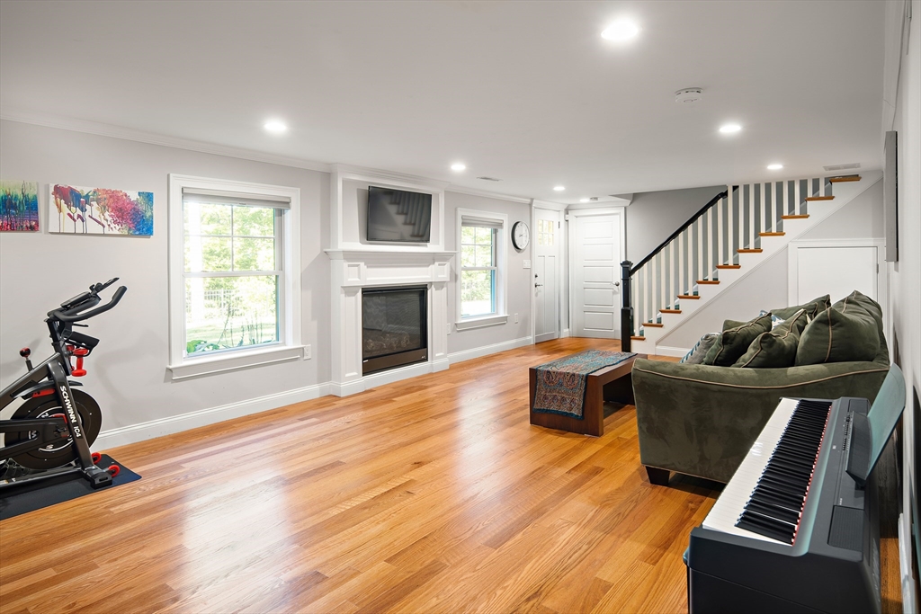 22 Peachtree Road Lexington, MA 02420 - Photo 24 of 42 a living room with furniture and a wooden floor