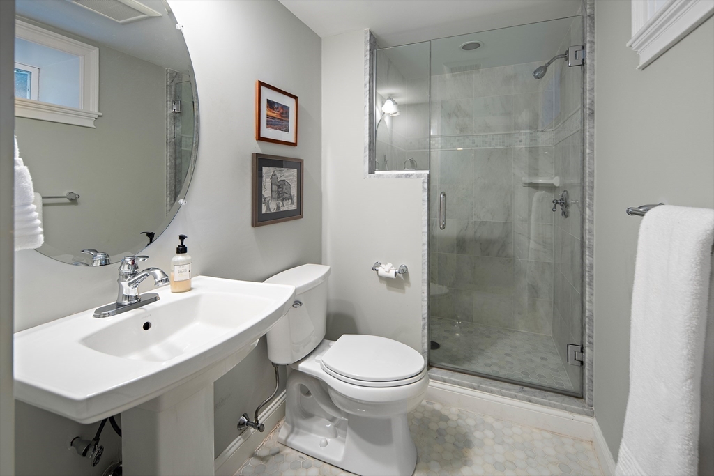 22 Peachtree Road Lexington, MA 02420 - Photo 27 of 42 a bathroom with a sink toilet and shower