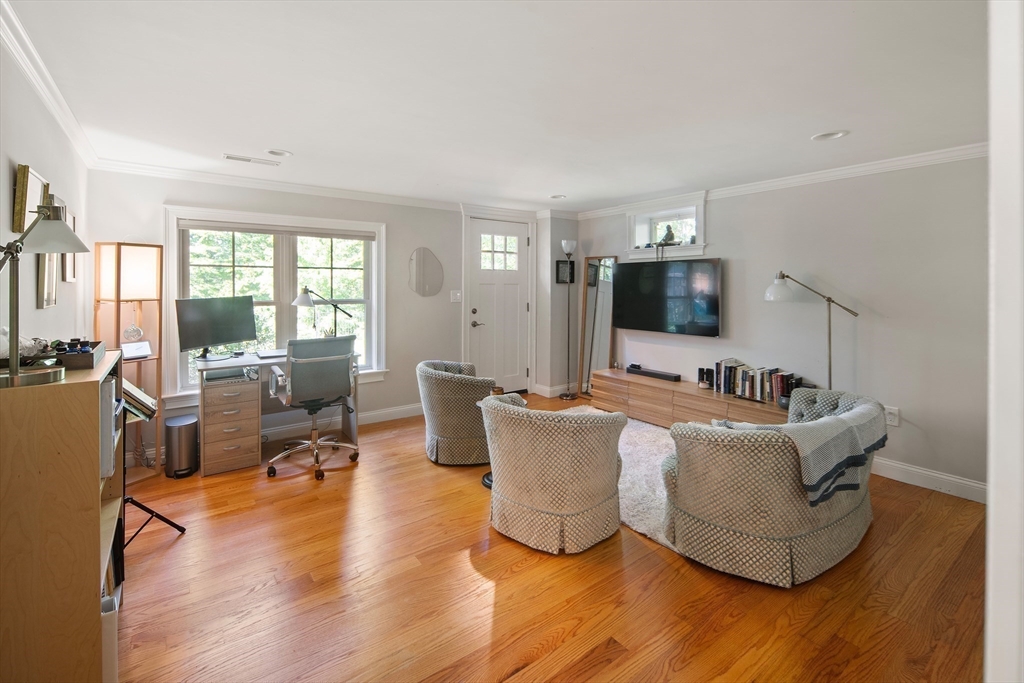22 Peachtree Road Lexington, MA 02420 - Photo 28 of 42 a living room with furniture and a flat screen tv