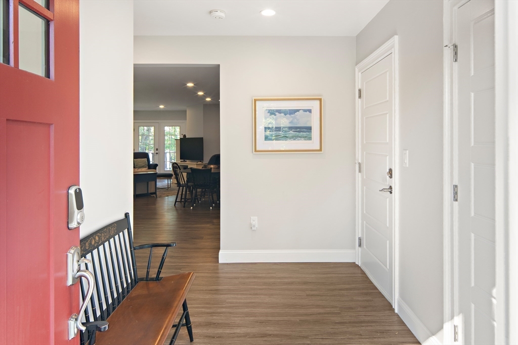 22 Peachtree Road Lexington, MA 02420 - Photo 31 of 42 a view of a hallway with wooden floor and furniture