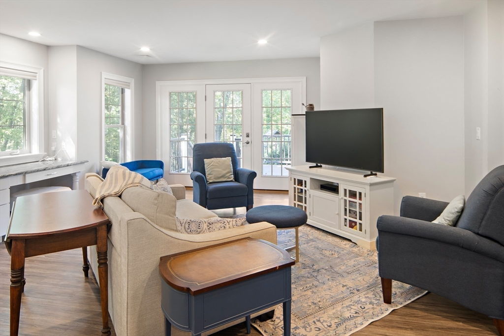 22 Peachtree Road Lexington, MA 02420 - Photo 34 of 42 a living room with furniture and a flat screen tv