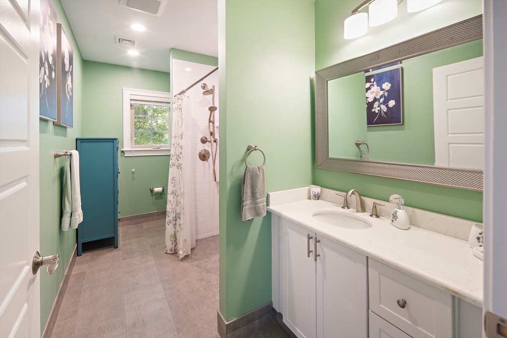 22 Peachtree Road Lexington, MA 02420 - Photo 37 of 42 a spacious bathroom with a sink double vanity and a mirror