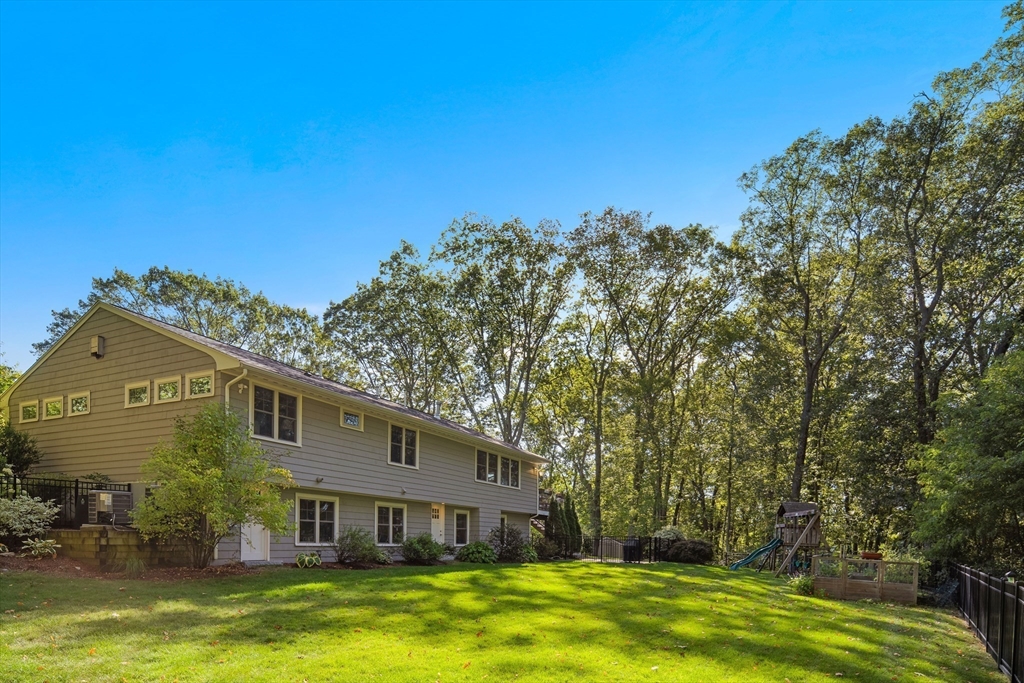 22 Peachtree Road Lexington, MA 02420 - Photo 39 of 42 a front view of a house with a yard