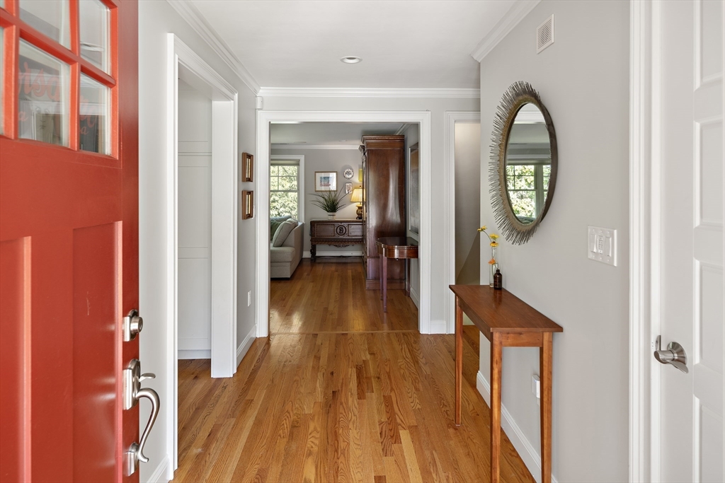22 Peachtree Road Lexington, MA 02420 - Photo 4 of 42 a view of a hallway with wooden floor and furniture