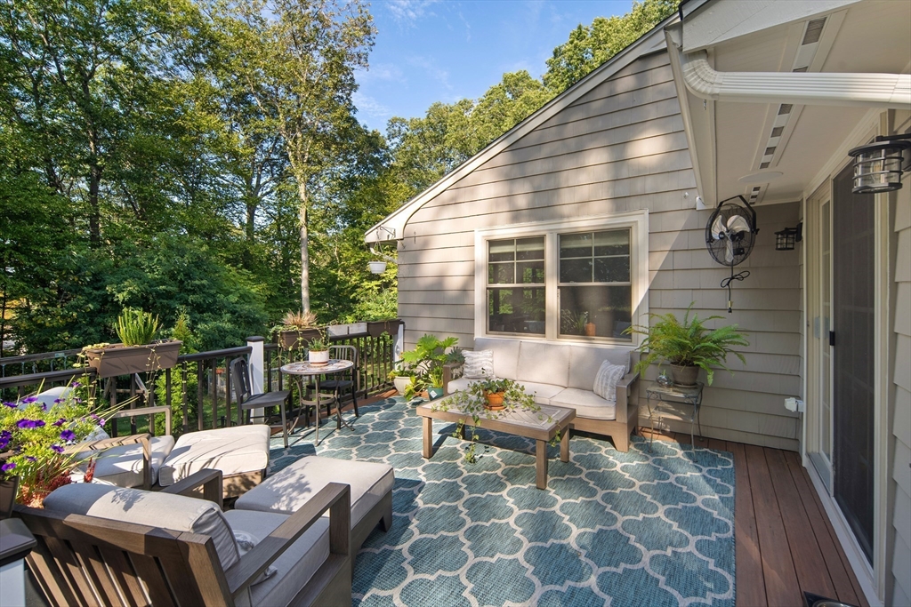 22 Peachtree Road Lexington, MA 02420 - Photo 10 of 42 a view of a house with backyard sitting area and garden