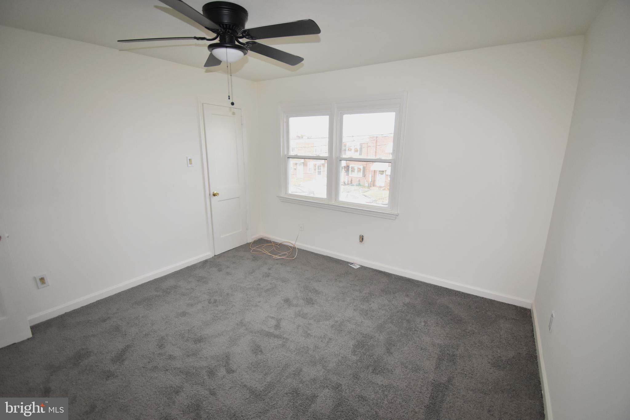 76 West 4th Street Burlington, NJ 08016 - Photo 12 of 15 an empty room with a window and a fan