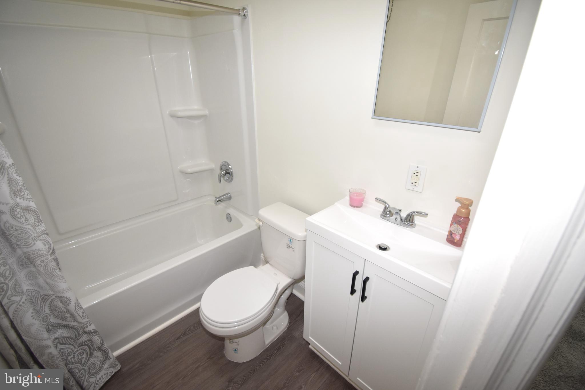 76 West 4th Street Burlington, NJ 08016 - Photo 15 of 15 a bathroom with a sink toilet and bathtub