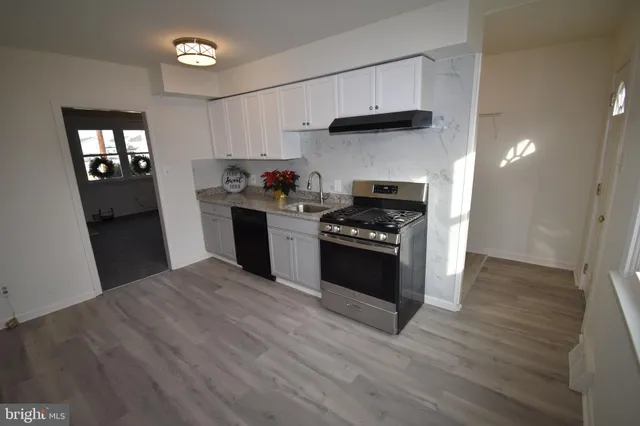 a kitchen with a stove and a refrigerator