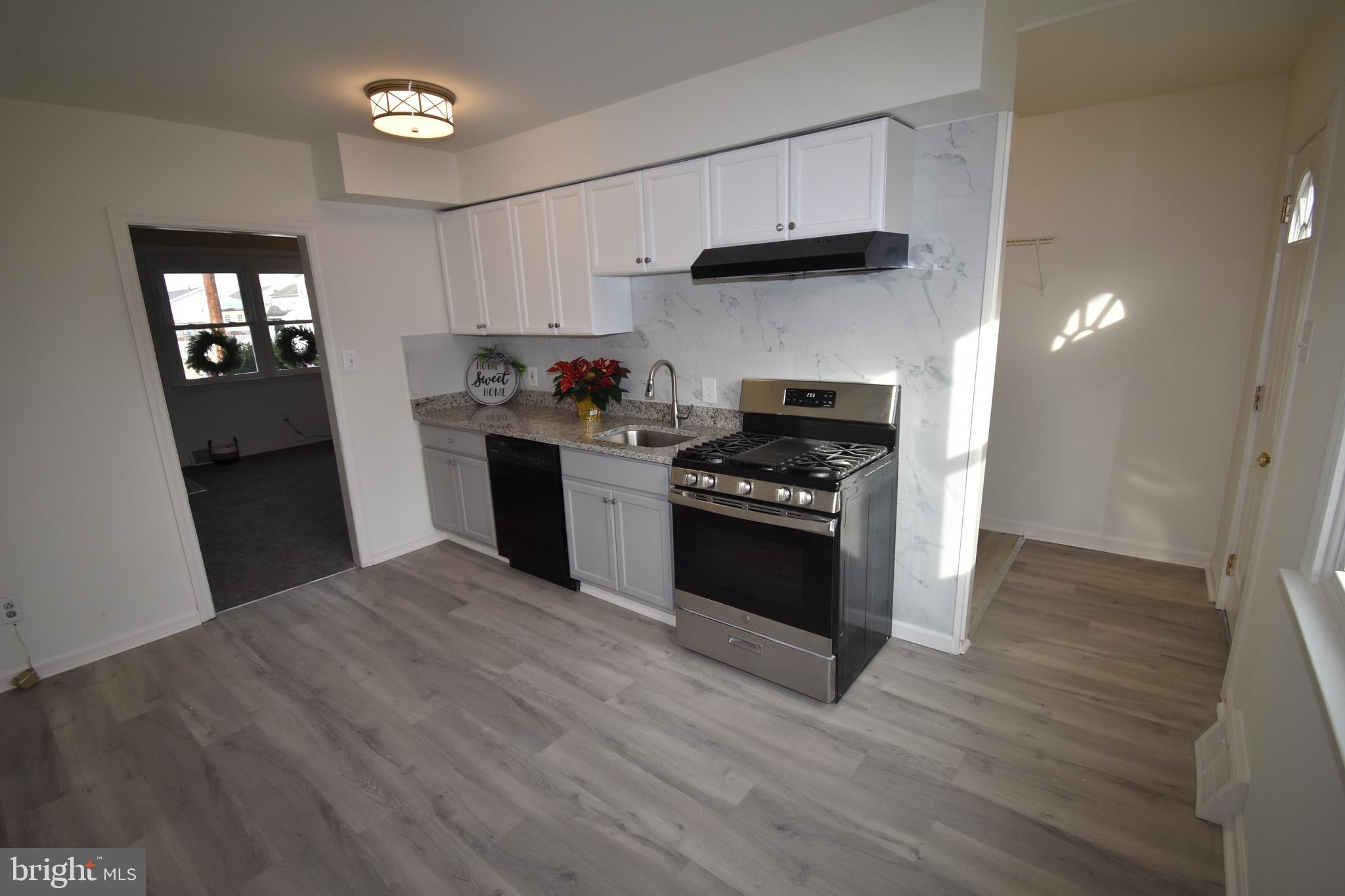 76 West 4th Street Burlington, NJ 08016 - Photo 7 of 15 a kitchen with a stove and a refrigerator
