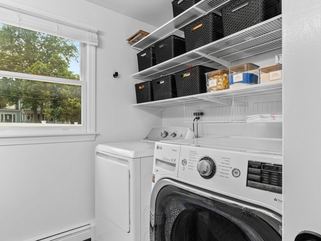 168 Maple Street Boston, MA 02132 - Photo 12 of 39 a utility room with dryer and washer