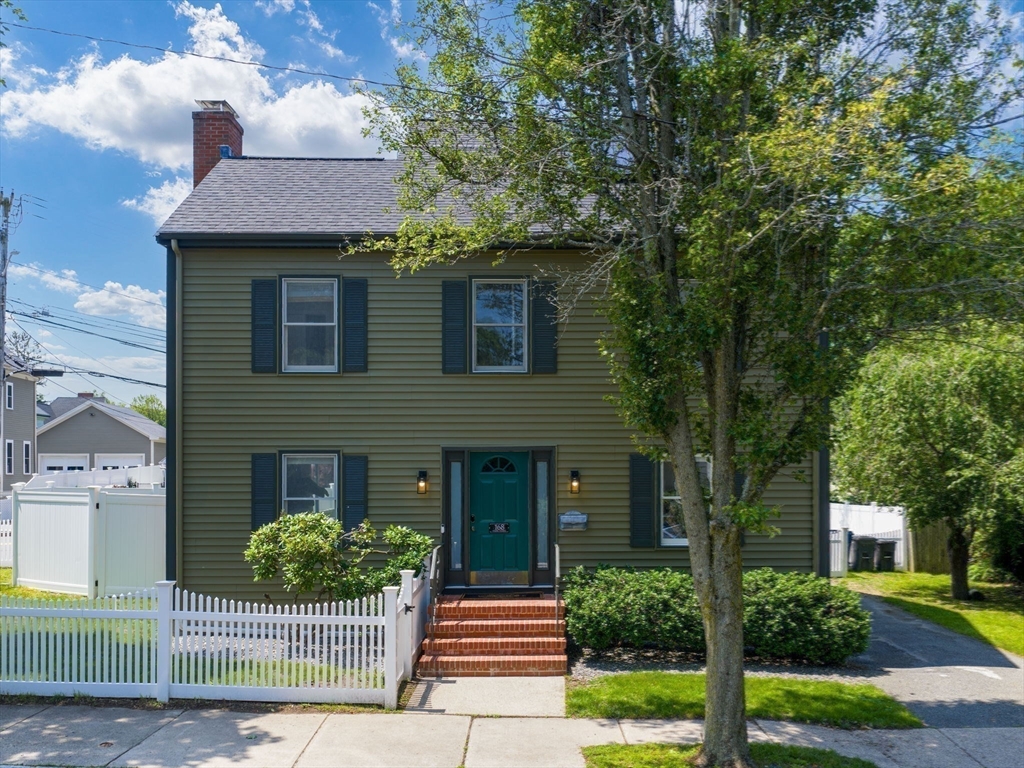 168 Maple Street Boston, MA 02132 - Photo 13 of 39 a front view of a house with garden